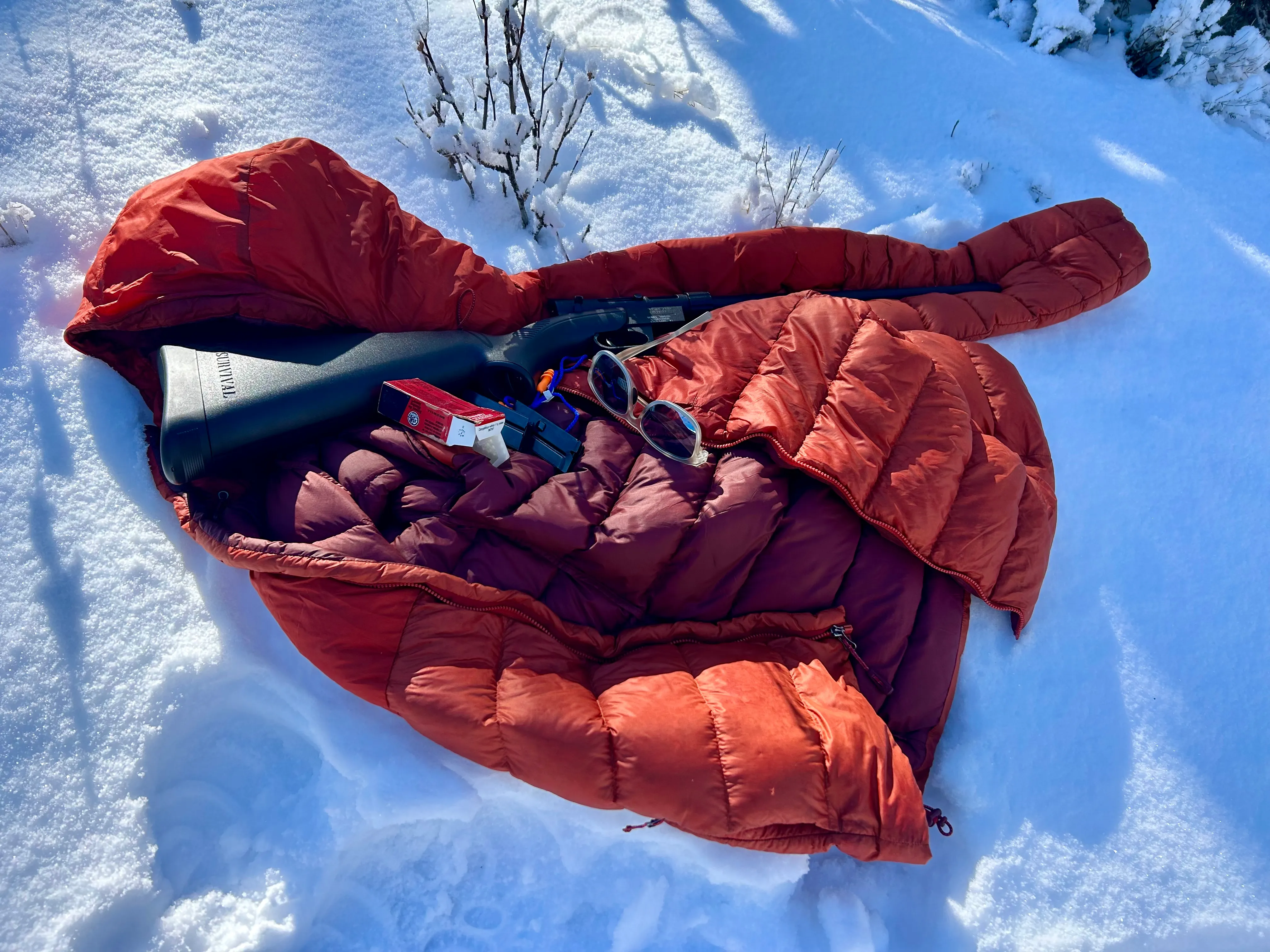 gun on the coat on the ground.